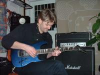 Playing the guitar.